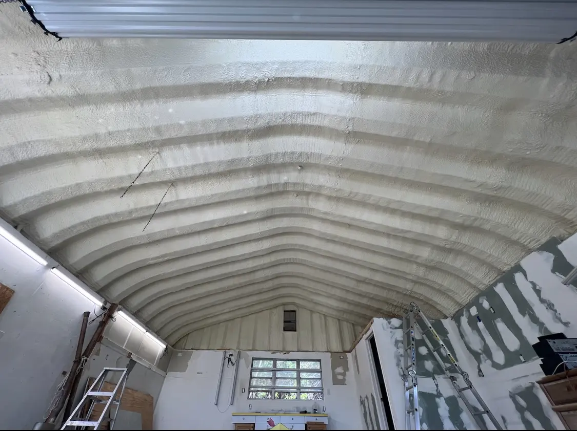 Spray polyurethane foam applied to the underside of a metal roof deck in Jesup